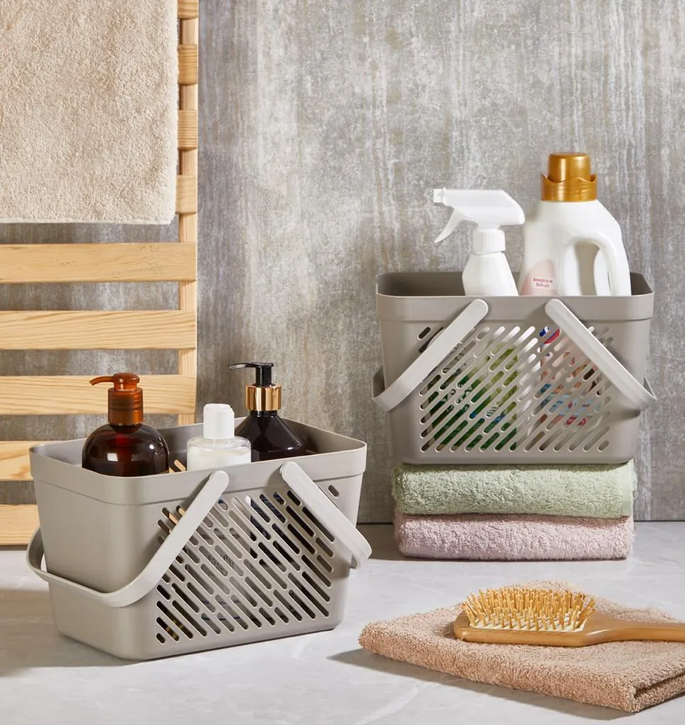 Beige multi-purpose baskets with handles in a bathroom