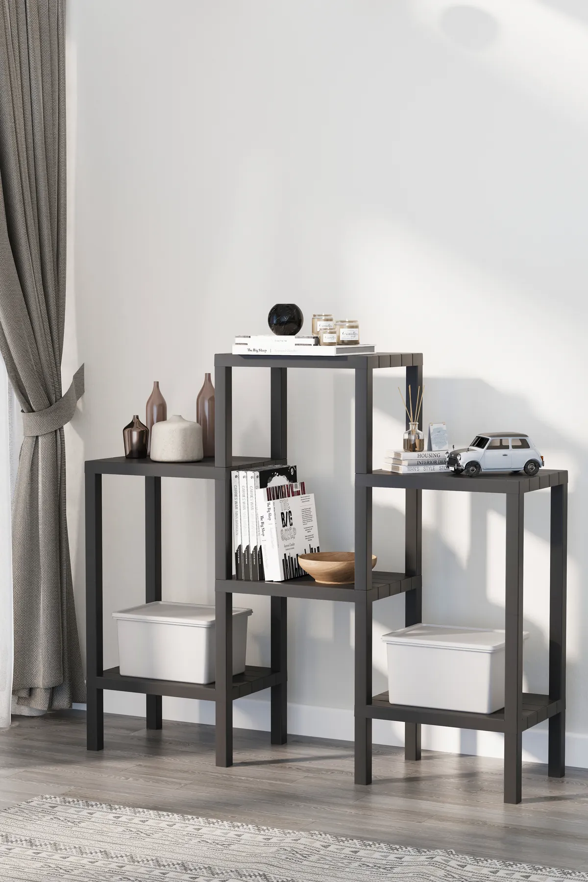 Black shelving unit with tiers at different heights